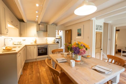 Useful utility room beyond the kitchen leading to a shower & toilet room.