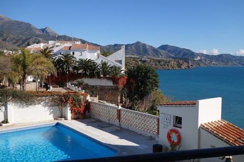 Beautiful view of pool and sea from the apartment