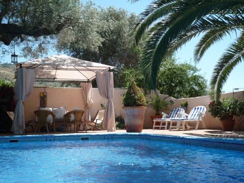Private poolside relaxation by the walled and gated sparkling pool