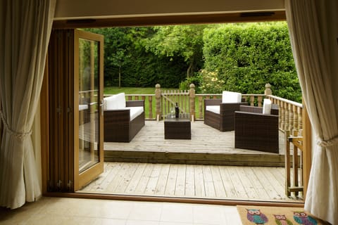 Owl's Hoot patio, seen from the lounge. A hot tub has now been added too.