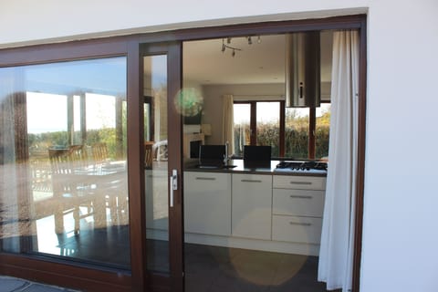 The kitchen from outside - the big doors and windows let in plenty of light and 