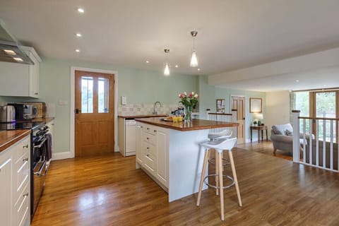 Off the kitchen is the open plan snug