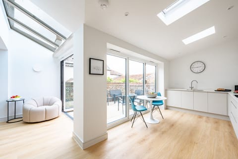 Ground floor: The L-shaped kitchen/dining room with dual bi-fold doors