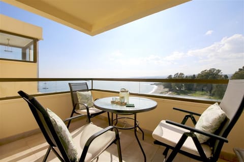 South-west facing balcony with outdoor dining area and stunning sea views