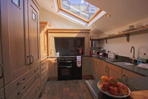 Spacious and bright kitchen with all modern appliances and ample storage.