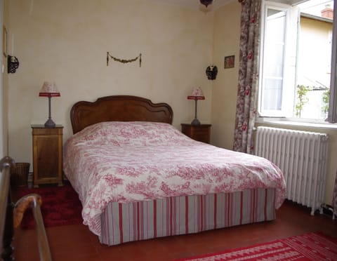 Red bedroom with en suite bathroom and east and west facing windows