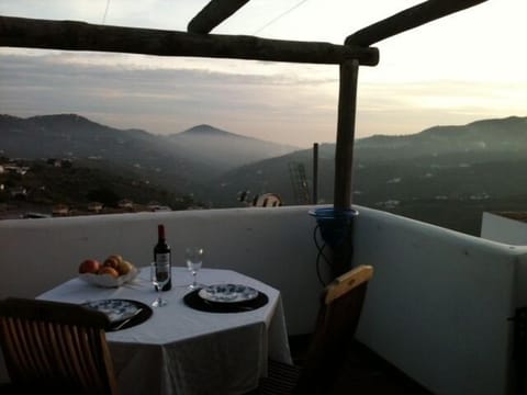 An evening glass of wine on the terrace. On a clear day, you can see the sea.
