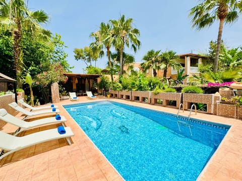 Enjoy you private pool surrounded by a lush garden. 