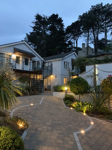 The apartment & courtyarden garden, fully lit after dusk. 