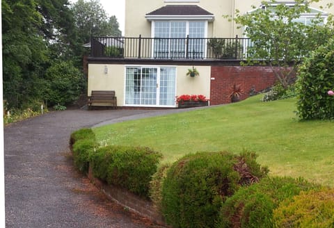 The outside of the studio with part of the garden in view