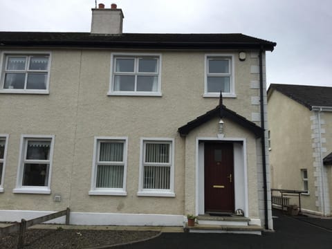 Front of house, parking for 3 cars