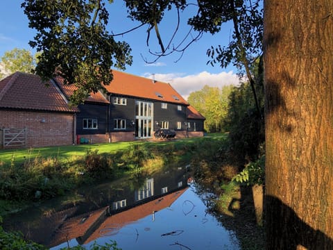 The barn viewed from across the pond