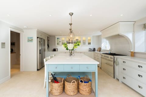 Kitchen leading into a utility room