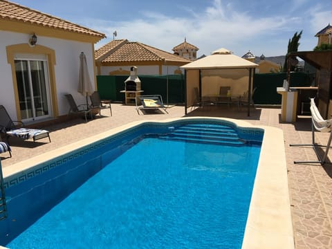 Chill by the pool on sun beds, hammock, in the pool, by the bar or Gazebo
