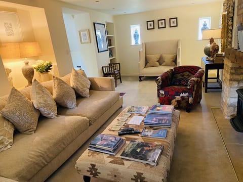 Beautiful cosy sitting room filled with antiques and gorgeous paintings