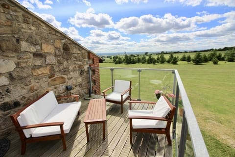 Raised balcony with extensive views overlooking open countryside