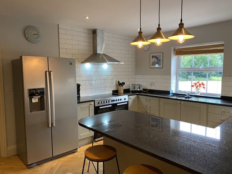 New kitchen with granite worktops and a range cooker