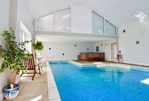 Private heated indoor swimming pool with hot tub