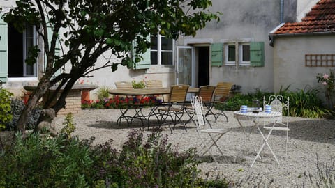 sunny sheltered courtyard , lovely for dining al fresco