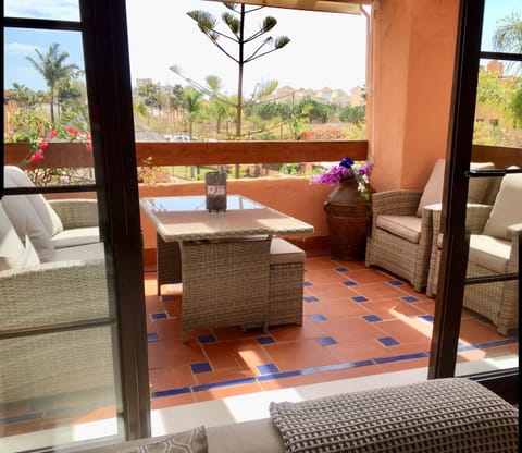 Terrace overlooking pool and tropical gardens a short walk to the beach