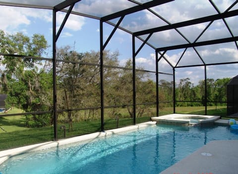 Pool area with spa & conservation views