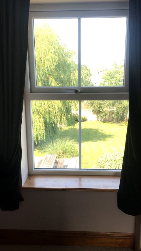 Beautiful view over the delightful garden from the Master Bedroom rear window.