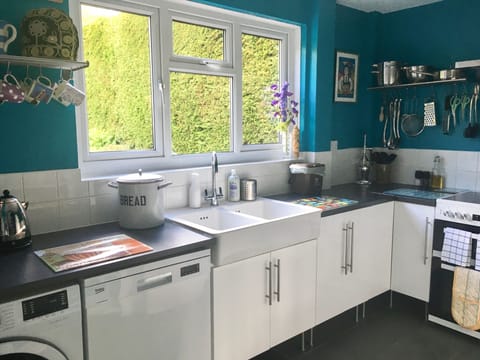 country style kitchen with slate tiled underfloor heating and modern appliances
