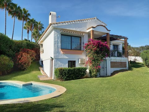 Back of villa, pool and garden