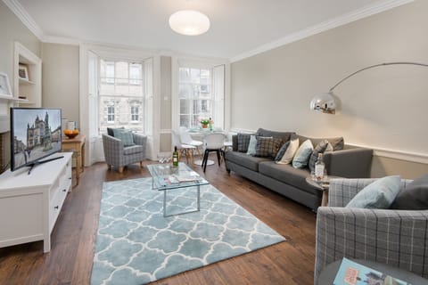 Sitting room and dining area - with views onto the Royal Mile and High Street