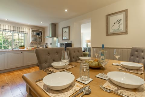 Ground floor: Dining area with seating for five