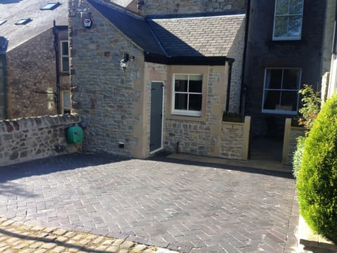 Back of house with parking  space for 2 cars