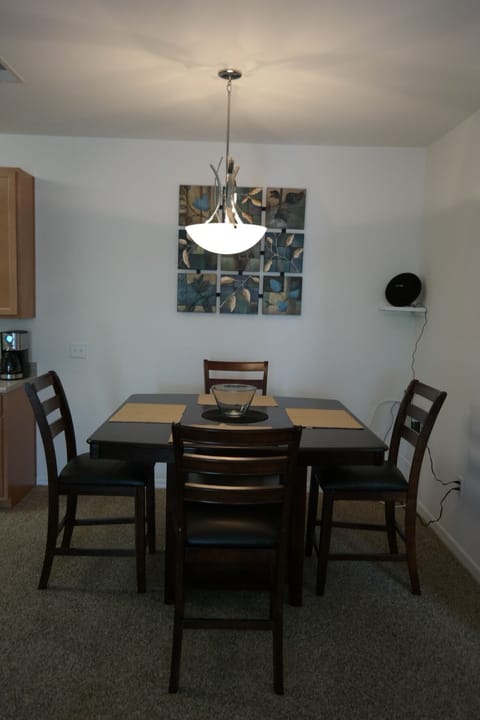 Dining table next to kitchen