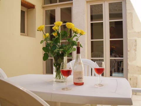 Internal courtyard with outdoor table and chairs.