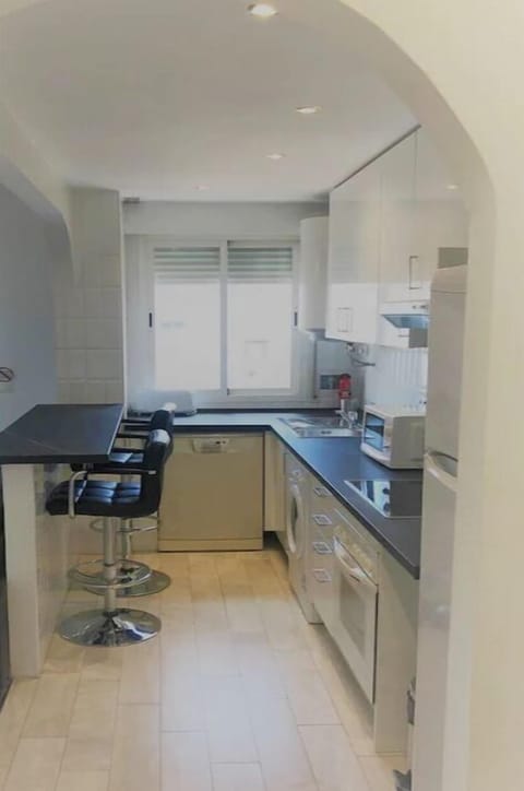 Kitchen - washing machine, dishwasher, oven, hob and fridge freezer.