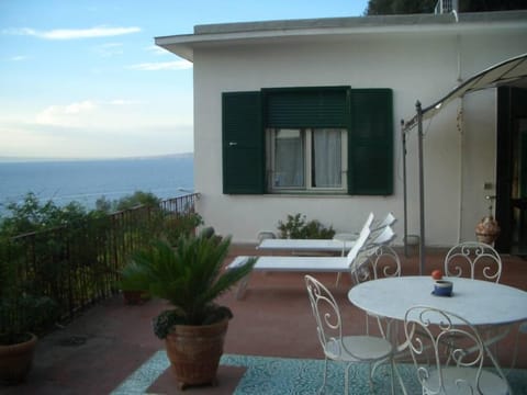 terrace with gazebo, sun loungers and sdrajo