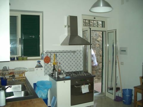 the kitchen with a second entrance from the terrace