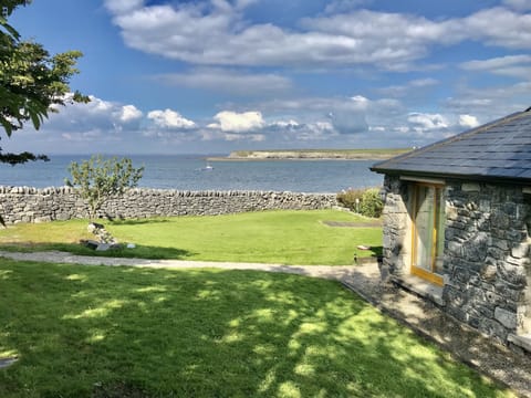 view of house and sea with Jerry the fisherman bringing back daily fresh fish