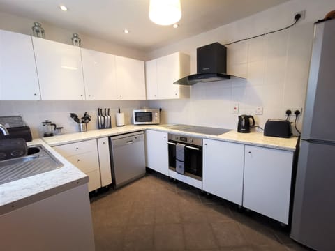 Bright modern kitchen with large fridge/freezer