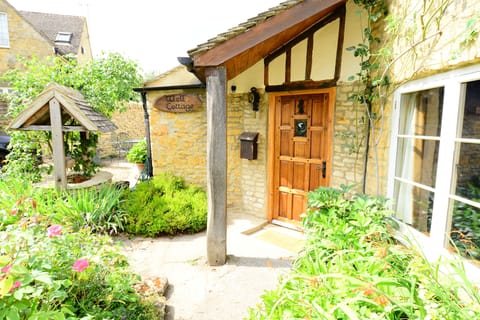 Welcome!
Oak front door to Well Cottage with canopy over the door.