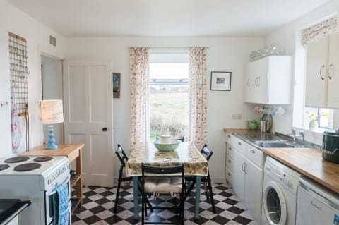 Kitchen with washing machine. Dryer in utility room. Freezer. And fabulous views