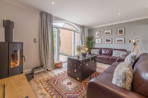 Kipling House, Wells-next-the-Sea: Sitting room with feature wood burning stove
