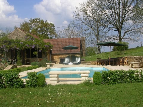 Pool in Spring with lovely stone benches made by my husband
