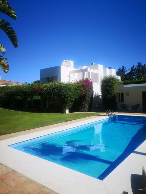 Pool, garden and rear aspect 