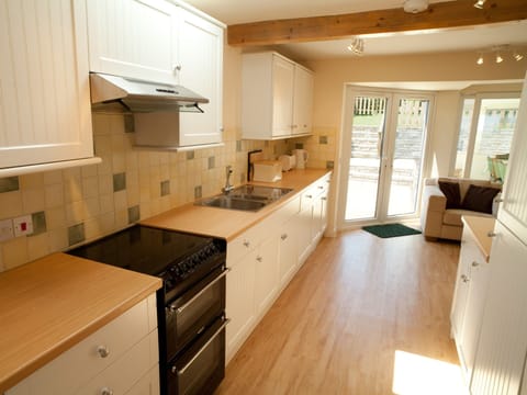 Generously Equipped Kitchen - with lots of extras - french doors to terrace