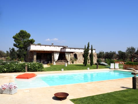 Pool area overlooking the villa and garden