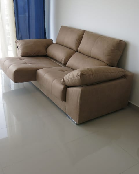 Reclining sofa in living area equipped with TV, WiFi internet and android box.