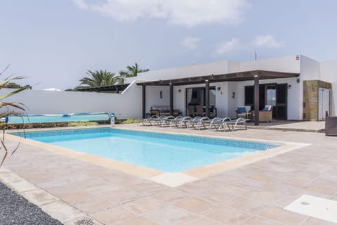 Rear terrace with private pool looking towards villa