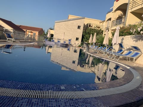 Family pool with sunbeds