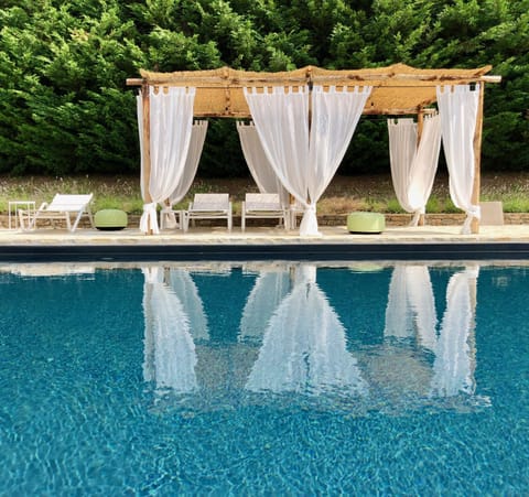 the heated pool and gazebo in summer