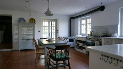 kitchen with door leading to dining room and door leading to veranda terrace
